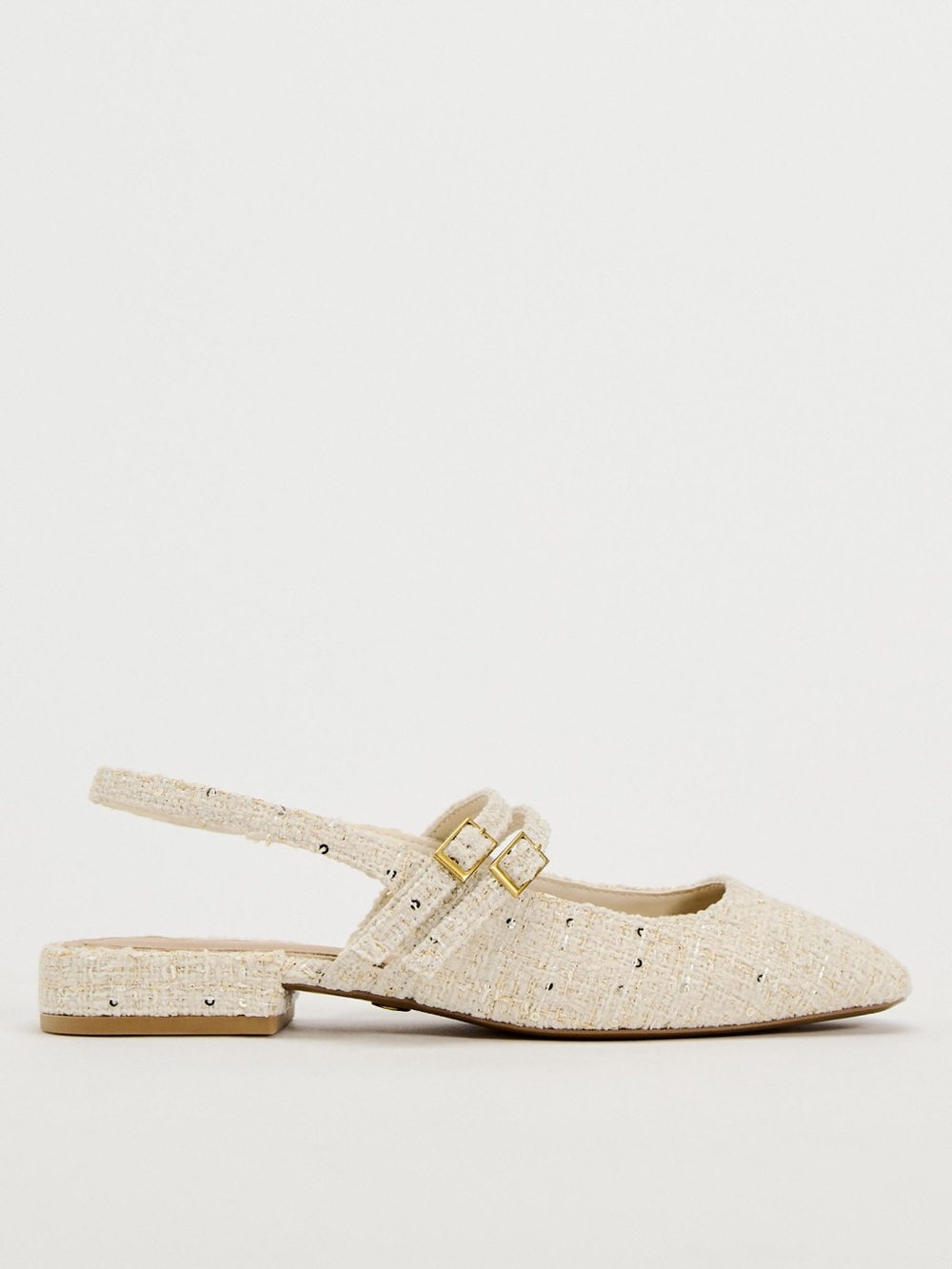 Cream-colored Zara fabric slingback mules featuring a pointed toe and double buc